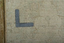 Backside of handmade 1970s Vintage rug showing knot structure and weave density