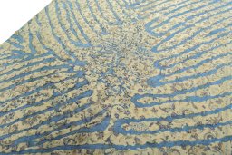 Backside of handmade 1970s Vintage rug showing knot structure and weave density