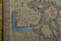 Backside of handmade 1950s Vintage rug showing knot structure and weave density