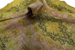 Surface texture of 1950s Vintage rug with natural Wool and intricate pattern