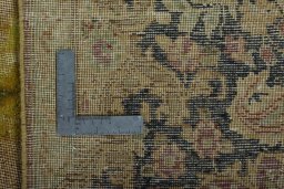 Backside of handmade 1950s Vintage rug showing knot structure and weave density