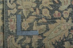 Backside of handmade 1970s Vintage rug showing knot structure and weave density