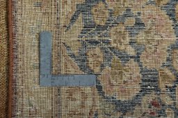 Backside of handmade 1950s Vintage rug showing knot structure and weave density