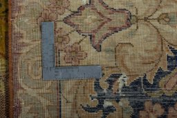 Backside of handmade 1950s Vintage rug showing knot structure and weave density