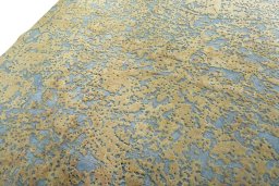 Backside of handmade 1950s Vintage rug showing knot structure and weave density