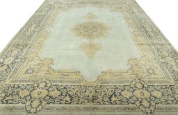 Surface texture of 1950s Vintage rug with natural Wool and intricate pattern