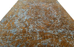Surface texture of 1950s Vintage rug with natural Wool and intricate pattern