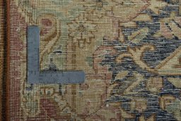 Backside of handmade 1950s Vintage rug showing knot structure and weave density
