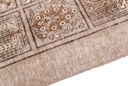 Backside of handmade 1950s Vintage rug showing knot structure and weave density