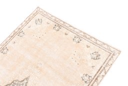 Surface texture of 1972s Vintage rug with natural Wool and intricate pattern