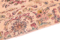 Backside of handmade 1960s Vintage rug showing knot structure and weave density