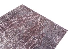 Surface texture of 1950s Vintage rug with natural Wool and intricate pattern