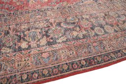 Backside of handmade 1980s Vintage rug showing knot structure and weave density
