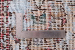 Surface texture of 1950s Vintage rug with natural Wool and intricate pattern
