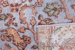 Close-up detail of 1950s Vintage rug from Iran / Persia showing Wool weave
