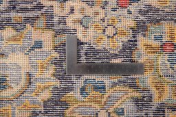 Backside of handmade 1980s Vintage rug showing knot structure and weave density