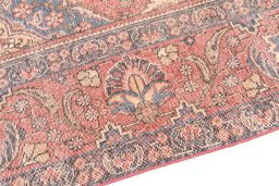 Surface texture of 1955s Vintage rug with natural Wool and intricate pattern