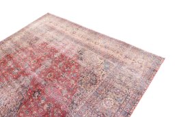 Surface texture of 1950s Vintage rug with natural Wool and intricate pattern