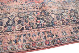 Backside of handmade 1970s Vintage rug showing knot structure and weave density