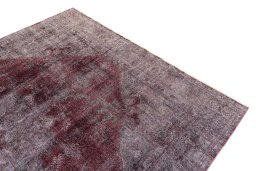 Surface texture of 1950s Vintage rug with natural Wool and intricate pattern