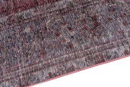 Backside of handmade 1950s Vintage rug showing knot structure and weave density