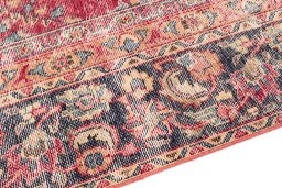 Backside of handmade 1950s Vintage rug showing knot structure and weave density
