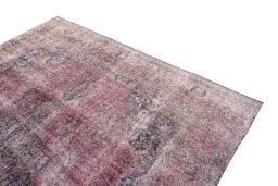 Surface texture of 1955s Vintage rug with natural Wool and intricate pattern