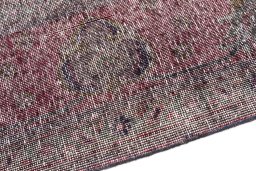 Backside of handmade 1955s Vintage rug showing knot structure and weave density
