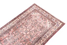 Surface texture of 1950s Vintage rug with natural Wool and intricate pattern