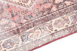 Backside of handmade 1950s Vintage rug showing knot structure and weave density