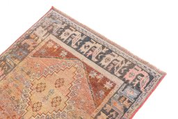 Surface texture of 1955s Vintage rug with natural Wool and intricate pattern