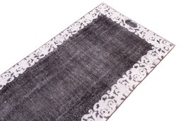 Surface texture of 1975s Vintage rug with natural Wool and intricate pattern