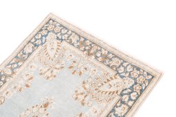 Surface texture of 1955s Vintage rug with natural Wool and intricate pattern