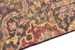 Backside of handmade 1945s Vintage rug showing knot structure and weave density