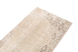 Surface texture of 1970s Vintage rug with natural Wool and intricate pattern