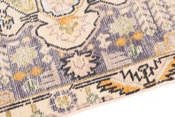 Backside of handmade 1970s Vintage rug showing knot structure and weave density