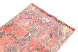 Surface texture of 1975s Vintage rug with natural Wool and intricate pattern