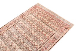 Surface texture of 1976s Vintage rug with natural Wool and intricate pattern