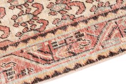 Backside of handmade 1976s Vintage rug showing knot structure and weave density