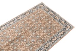 Surface texture of 1970s Vintage rug with natural Wool and intricate pattern