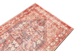 Surface texture of 1970s Vintage rug with natural Wool and intricate pattern