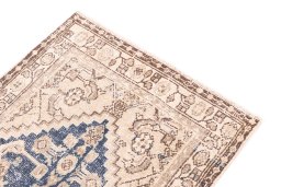 Surface texture of 1970s Vintage rug with natural Wool and intricate pattern