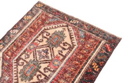 Surface texture of 1972s Vintage rug with natural Wool and intricate pattern