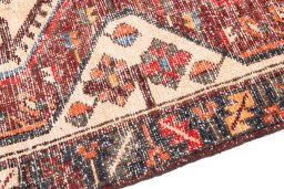Backside of handmade 1972s Vintage rug showing knot structure and weave density