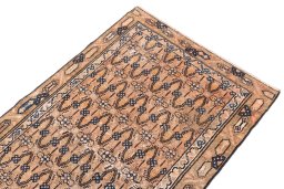 Surface texture of 1970s Vintage rug with natural Wool and intricate pattern