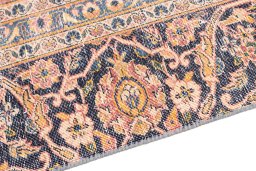 Backside of handmade 1977s Vintage rug showing knot structure and weave density