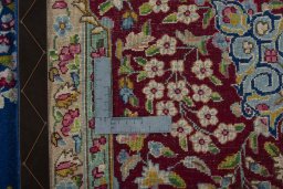 Backside of handmade 1970s Kerman rug showing knot structure and weave density