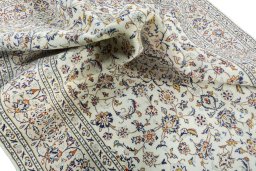Surface texture of 2000s Kashan rug with natural Wool and intricate pattern
