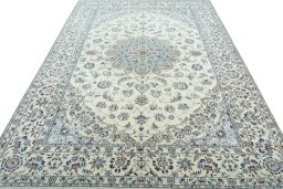 Surface texture of 2000s Nain rug with natural Wool and intricate pattern