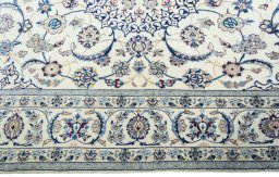 Corner detail of New Nain rug showing border pattern and Wool pile